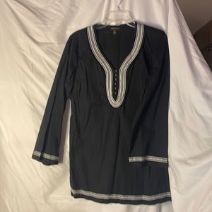Black tunic shirt with white trim.